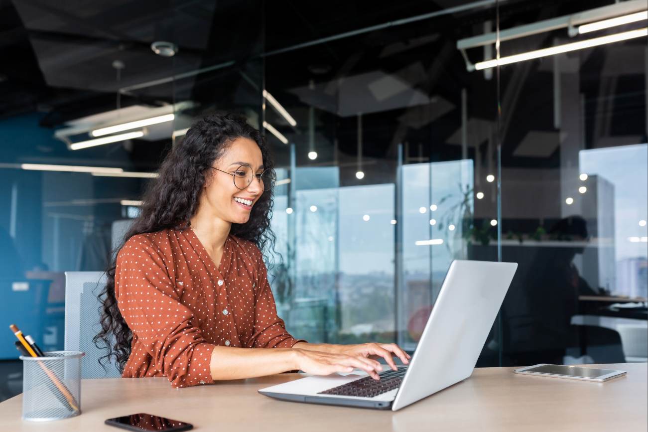 Woman working in laptop in modern office